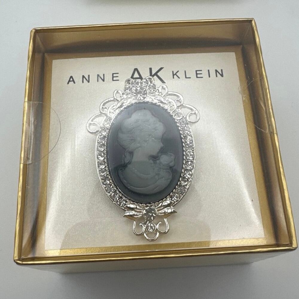 Anne Klein silver-tone victorian-style cameo brooch profile w/ rhinestone frame.